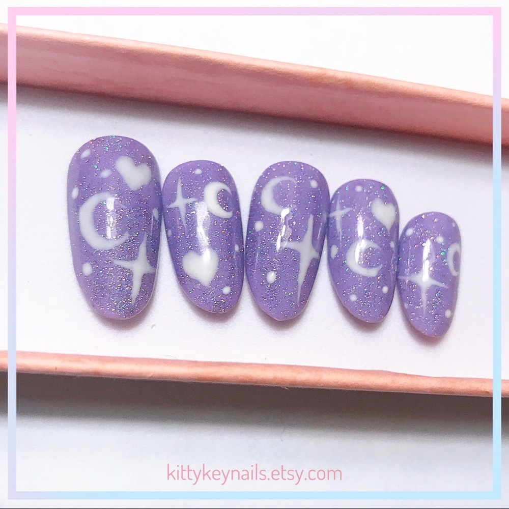 Sparkly purple press on nails with twinkle stars
